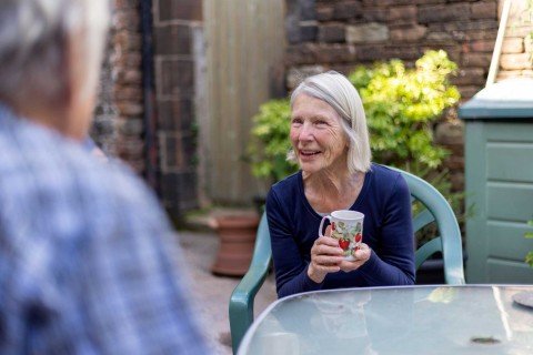 Smiling lady talks about opening an online or postal account with Marsden Building Society