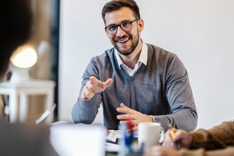 Smiling employee discussing Marsden Building Society's Workplace Savings scheme