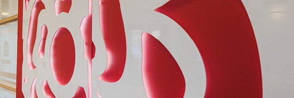 Close up of the interior of a Marsden Building Society office featuring the pink rose from their logo.