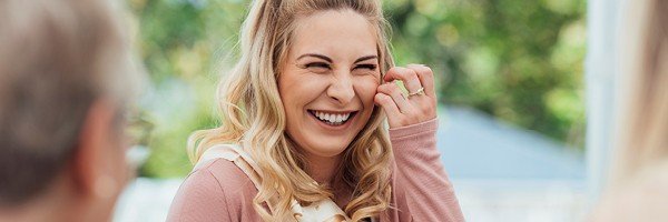 Mum-to-be smiles at her baby shower having saved for her child using her ISA allowance.