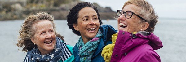 Group of friends enjoy the sea after opening a fixed rate bond with Marsden Building Society