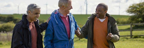 A family holding a piggy bank, taking their first steps towards saving