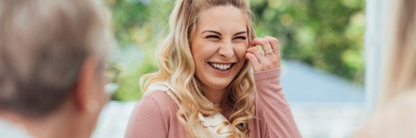 Mum-to-be smiles at her baby shower having saved for her child using her ISA allowance.