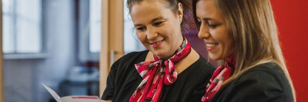 Marsden Building Society employees reading information about the Marsden