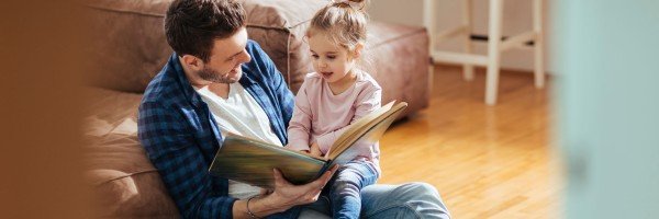 Smiling father spends time with his young daughter after applying for a Shared Ownership mortgage with the Marsden.