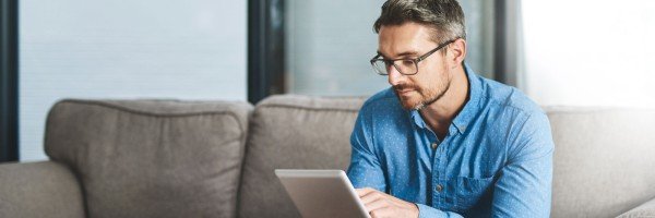 Man sits in his home after applying for a Residential mortgage with the Marsden, on behalf of his client.