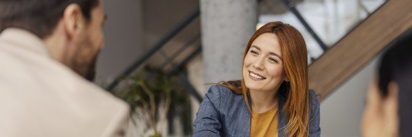 Person shaking hands as part of a business meeting