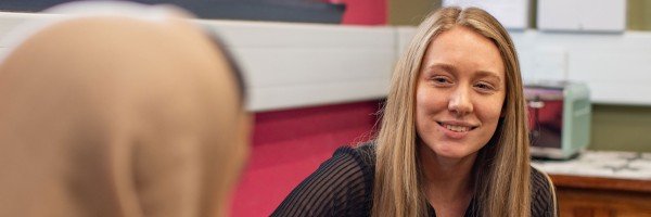 Female colleagues smile as they discuss their future at the Marsden