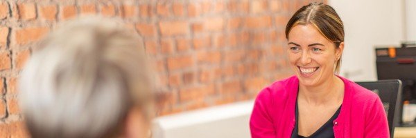 Marsden colleague smiles at customers in branch