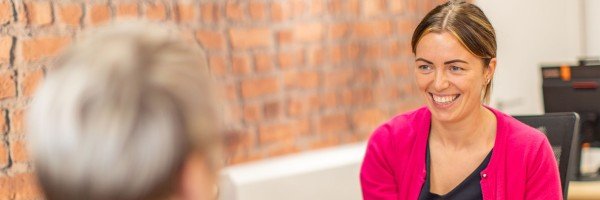 Marsden colleague smiles at customers in branch