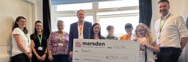 Pierre Blampied (SPF) presented a cheque to EnrichED team members and students, on behalf of Marsden Building Society