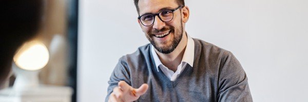 Smiling employee discussing Marsden Building Society's Workplace Savings scheme