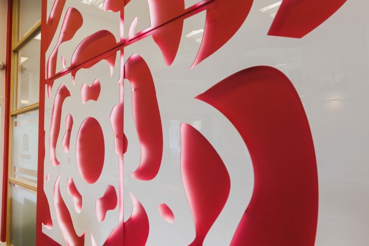 Close up of the interior of a Marsden Building Society office featuring the pink rose from their logo.