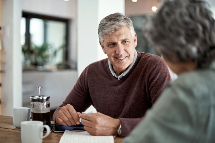 Mature couple smiling after applying for a Retirement Interest Only mortgage with Marsden Intermediaries.