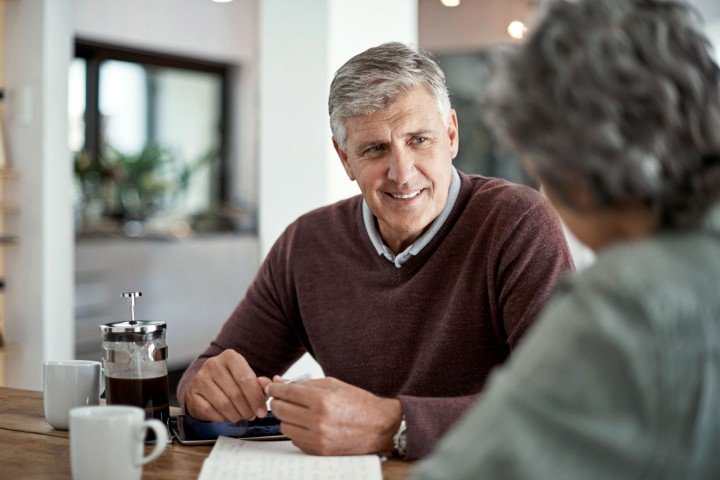 Smiling mature couple enjoy each other's company after applying for a Retirement Interest Only mortgage with the Marsden.