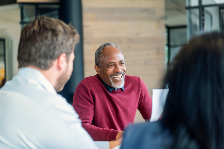 Business owner in a meeting knowing his savings are safe and secure with Marsden Building Society