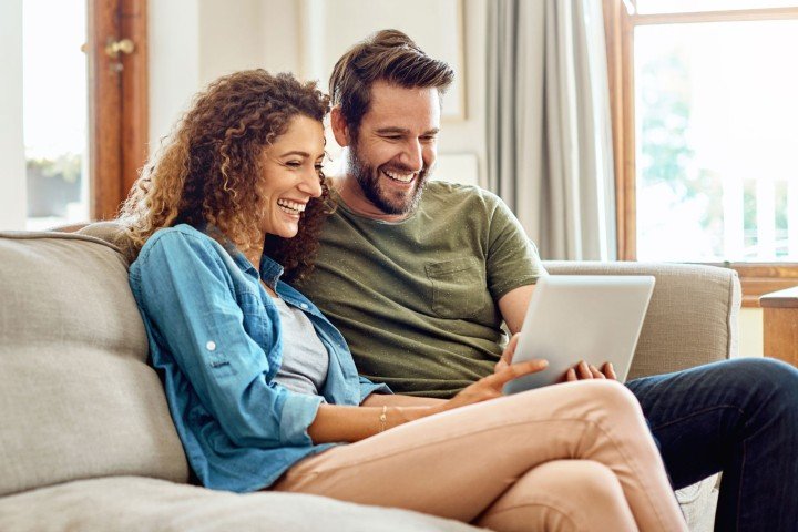 Couple open an Online Savings Account with the Marsden Building Society from the comfort of their own home