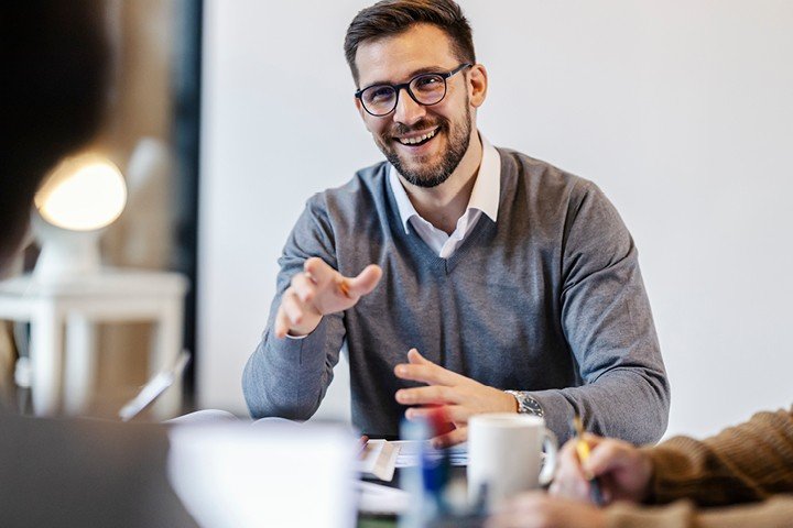 Smiling employee discussing Marsden Building Society's Workplace Savings scheme