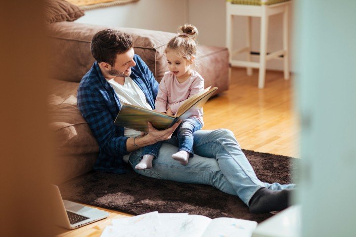 Smiling father spends time with his young daughter after applying for a Shared Ownership mortgage with the Marsden.
