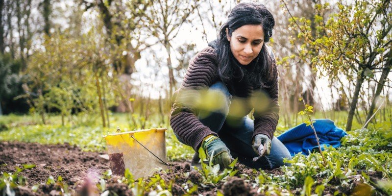 Woman works on community garden project after receiving funding from the Marsden Building Society Charitable Foundation.