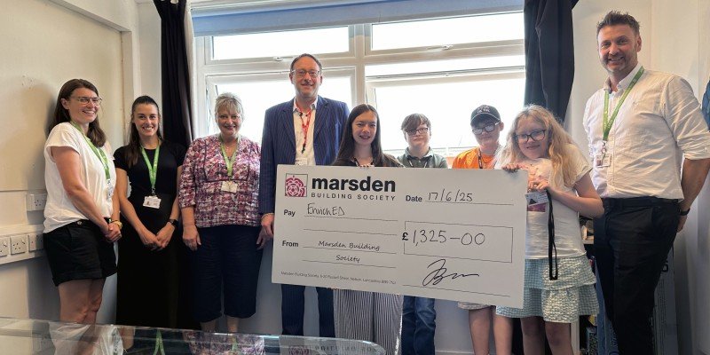 Pierre Blampied (SPF) presented a cheque to EnrichED team members and students, on behalf of Marsden Building Society